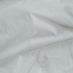 Closeup of percale cotton bedding in Chalk