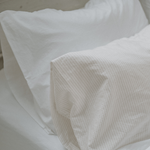 Pillow cases on bed - Chalk and pinstripes - Bedding set up ideas