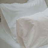 Pillow cases on bed - Chalk and pinstripes - Bedding set up ideas