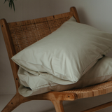 Percale cotton pillowcases on a chair - Sage - Breathable bed linens