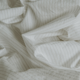 Closeup of percale cotton bedding - Pinstripe Chalk/Clay